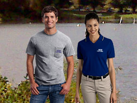 A man and woman wearing branded apparel at a public park